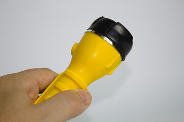 Yellow led flashlight with black nozzle