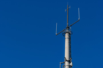 radio tower on blue sky for network