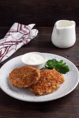 Buckwheat cutlets with cheese and parsley on a plate. Healthy diet food