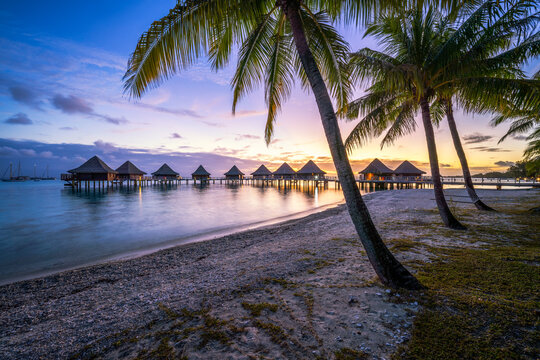 Sunset at a luxury beach resort in the South Seas