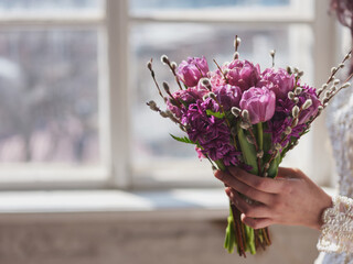 Bouquet of wedding flowers in hands