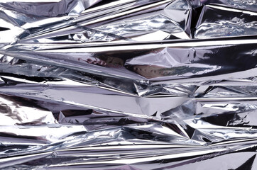 Shiny silver background.Empty space.Crumpled foil texture
