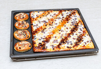 Fresh homemade delicious pies on a baking sheet