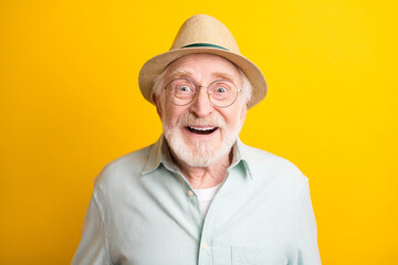 Photo of cute excited age gentleman wear green shirt spectacles headwear big eyes open mouth isolated yellow color background