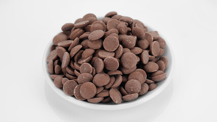 milk chocolate chips isolated on white background