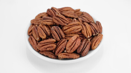 raw pecan nuts isolated on white background. Healthy food concept