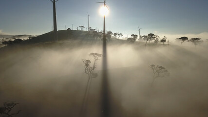 Wind turbine montait valley  in mist