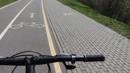 riding bicycle on bike track with symbols