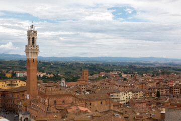Fototapeta na wymiar Siena,Top view of the Old Town - Piazza del Campo, Palazzo Pubblico di Siena, Torre del Mangia. Tuscany, Italy