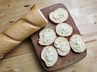 Garlic bread sprinkled with sheets before baking