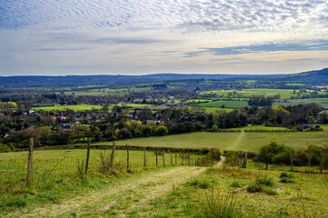 North Downs near Otford in Kent, UK. Scenic view of farmland and a view over the village of Otford. Otford is located on the North Downs Way and is a good base for exploring the countryside. - obrazy, fototapety, plakaty