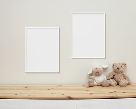 Two nursery frames mockup, 2 blank frames hanging on wall in baby room, soft toy bear and wooden blocks on shelf.
