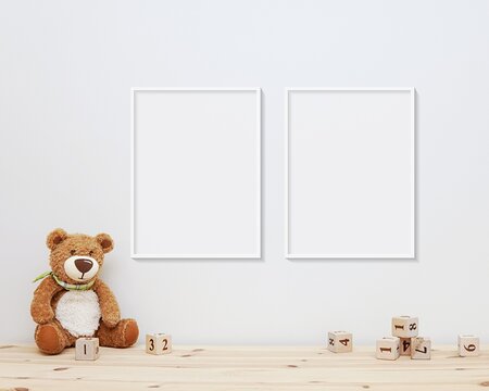 Two Nursery Frames Mockup, 2 Blank Frames Hanging On Wall In Baby Room, Soft Toy Bear And Wooden Blocks On Shelf.