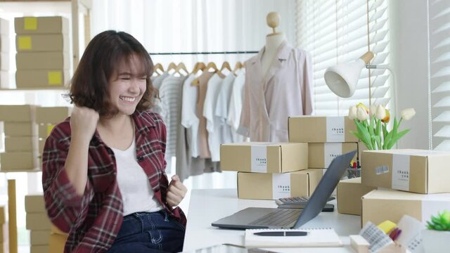 Young attractive beautiful female entrepreneur fund borrower crazy joyful ecstatic face gesture hand yes feeling amazed in peer to peer P2P lending finance or crowdfunding network microfinance approve