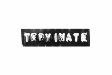 Fototapeta premium Embossed letter with word terminate in black banner on white paper background