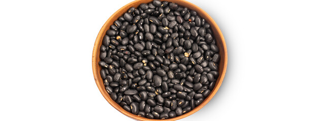 Black beans in wooden bowl on white background, top view, copy space