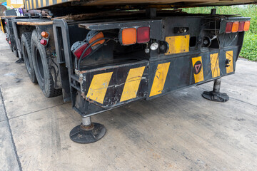 Obraz premium Outrigger mobile crane for heavy duty construction side. Hydraulic supports for the crane legs.