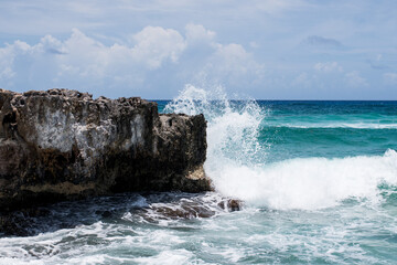 waves crashing on rocks in Mexico