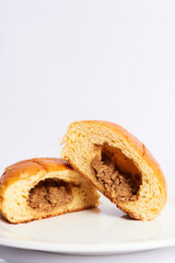 sliced meat bun on a plate