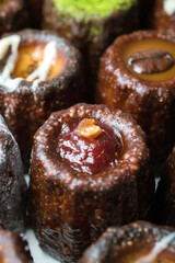 Caneles de bordeaux is a small pastry with rum and vanilla, traditional French sweet dessert.