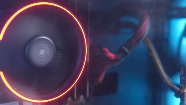 colorful bright rainbow led rgb pc fan air case cooler. gaming modding and technology concept background