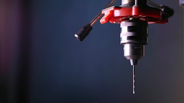Drilling machine rotation at the workplace of a toolman locksmith