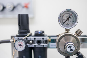 Pressure meter of tourniquet for reduce blood loss in orthopaedic surgery. Pressure pipeline inside operating room. - obrazy, fototapety, plakaty