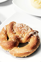 vegan dairy-free organic german pretzel bread on white table