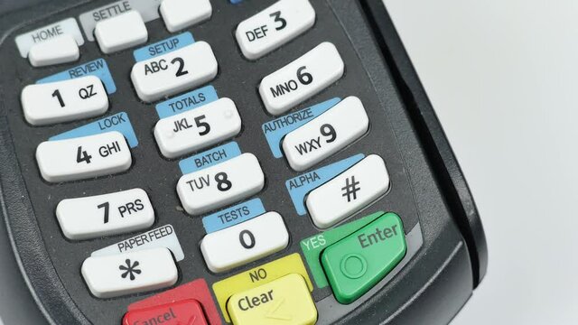 Credit card reader machine or Payment terminal with credit card on table slow pan 4K video