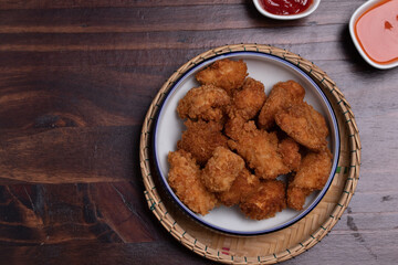 Crispy Chicken Pops Korean Style with Ketchup Chili sauce.