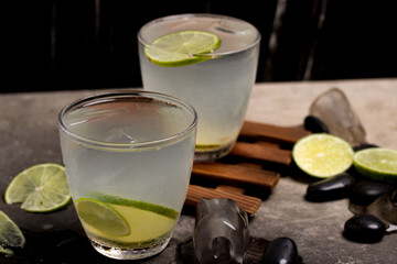 Refreshing lemonade in a clear glass decorated with fresh lemon.