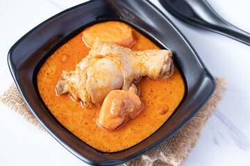 Chicken Mussaman Curry in black cups