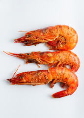 grilled prawns with garlic in sweet sour sauce over white background, Japanese style
