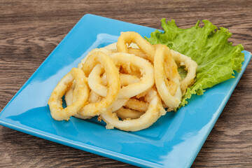 Roasted squid rings with salad