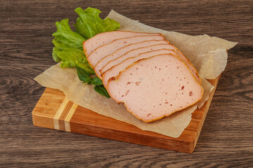Boiled pork sausage over board