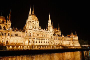 Panoramic view of the Parliament building in beautiful night lighting in Budapest. Left side