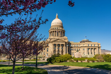 The Idaho State Capitol Building rises into a clear blue sky on a beautiful afternoon in Boise, Idaho.