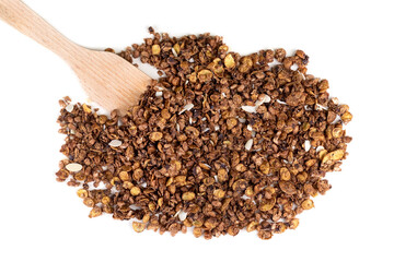 Organic homemade roasted granola cereal with oats, flax, almonds, chocolate with wooden spatula isolated on white background. Top view muesli