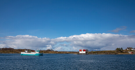City walk and spring in the air, with white clouds - Here Br&oslash;nn&oslash;ysund harbor and Buholmen island,Helgeland,Nordland county,Norway,scandinavia,Europe