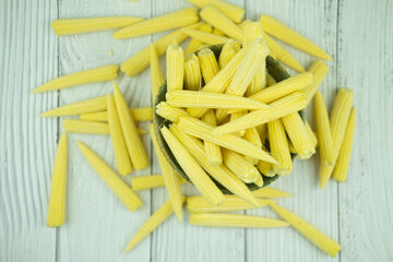 Pile fresh young baby corn in bowl