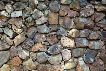 the stone wall at the park with sunlight  and shadow