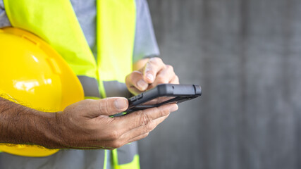 construction texting text message on smartphone