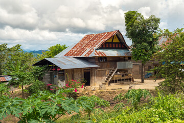 Fototapeta na wymiar Street villages with typical wooden house of the hard working people in the countryside of Sulawesi, often without water and electricity