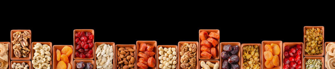 Horizontally Seamless flat lay food frame of dehydrated fruits, seeds and nuts on black. Non-perishable antioxidant gluten free foods concept