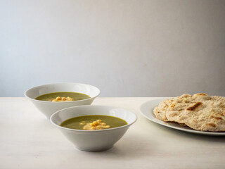 Molokhia (Jews Mallow, Jute Mallow, Mallow Leaves) Simple Traditional Egyptian Soup with Chickpeas and Flat Bread