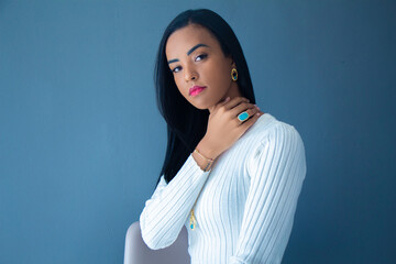 beautiful young woman posing with jewelry in photo studio