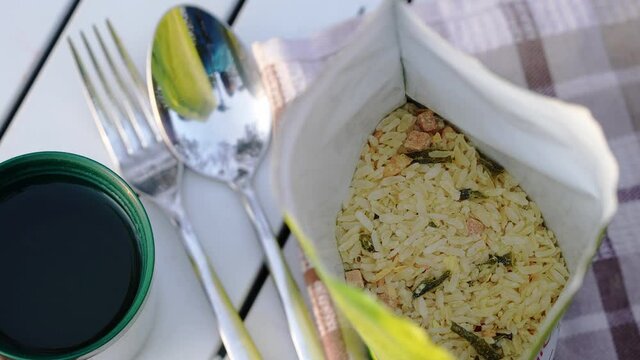Adding boiled water for special hiking food. sublimated food pack for camping. Easy Coocking tasty food at hiking or in camping. 4K UHD