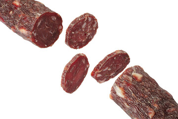 Dry meat sausage cutaway isolated on white background. Thin rings of delicious sausage.