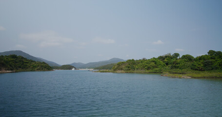 Countryside with mountain and sea
