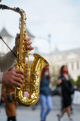 Fototapeta premium saxophone. saxophone detail in the center of Bucharest, Romania. wind instrument. photo during the day.